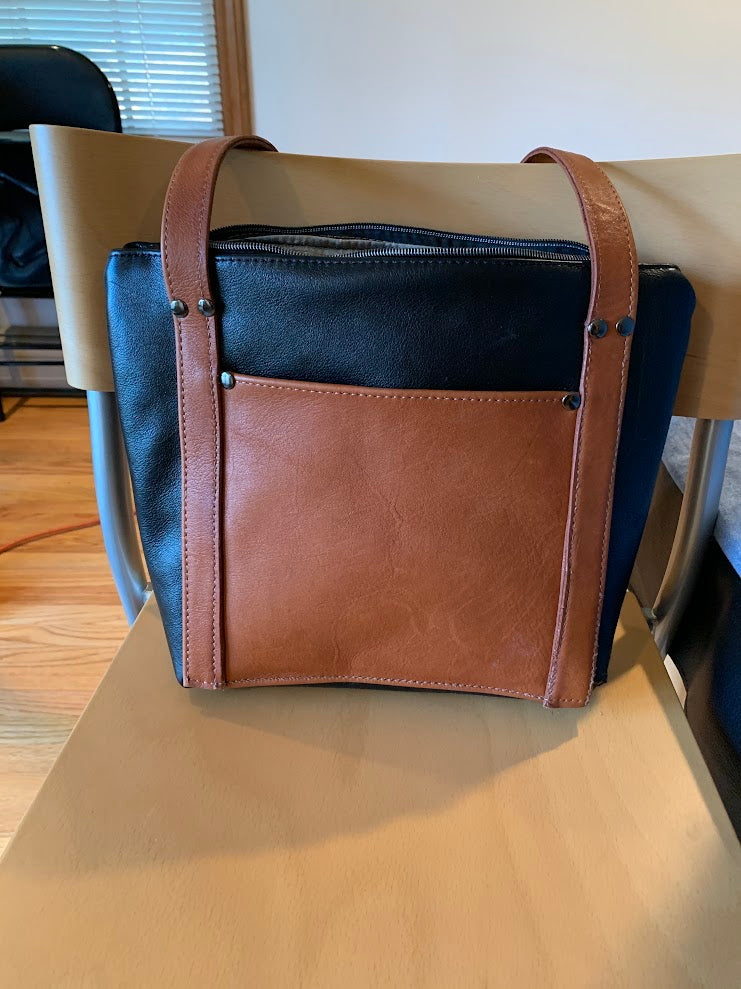 All leather tote with silk interior.