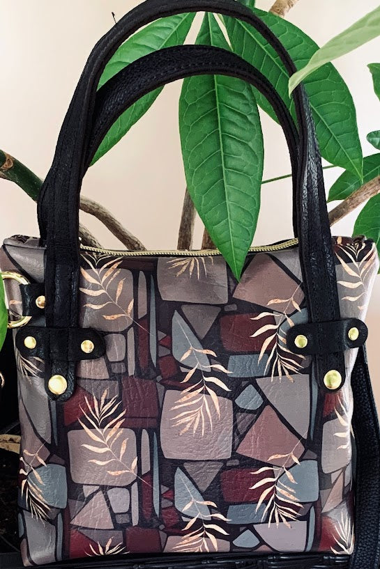 Designer vinyl crossbody with leather trim