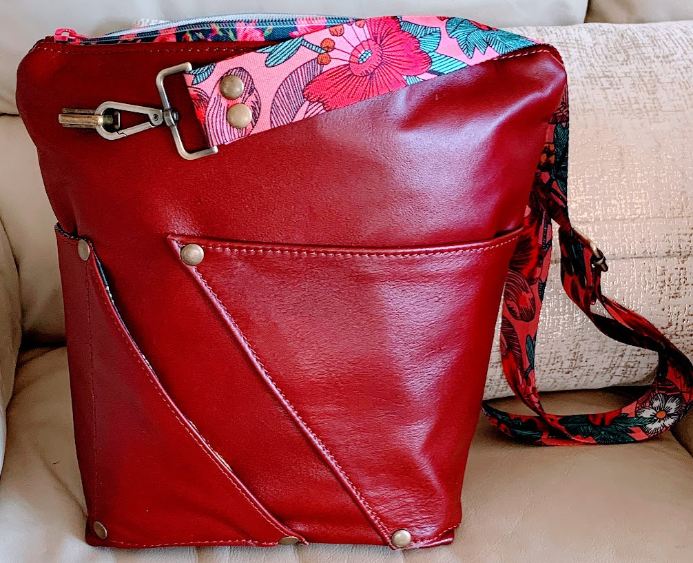 All leather , fully lined mid size crossbody with adjustable strap