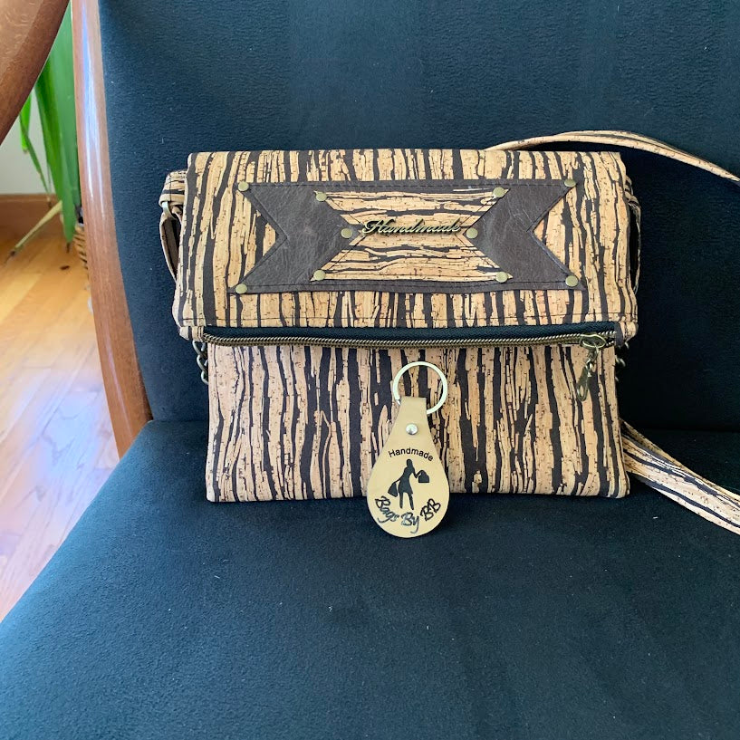 Cork crossbody with leather enhancement.