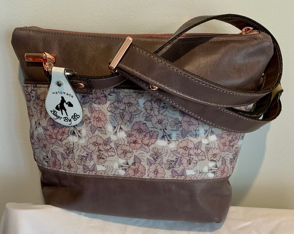 Combination crossbody of leather and cork