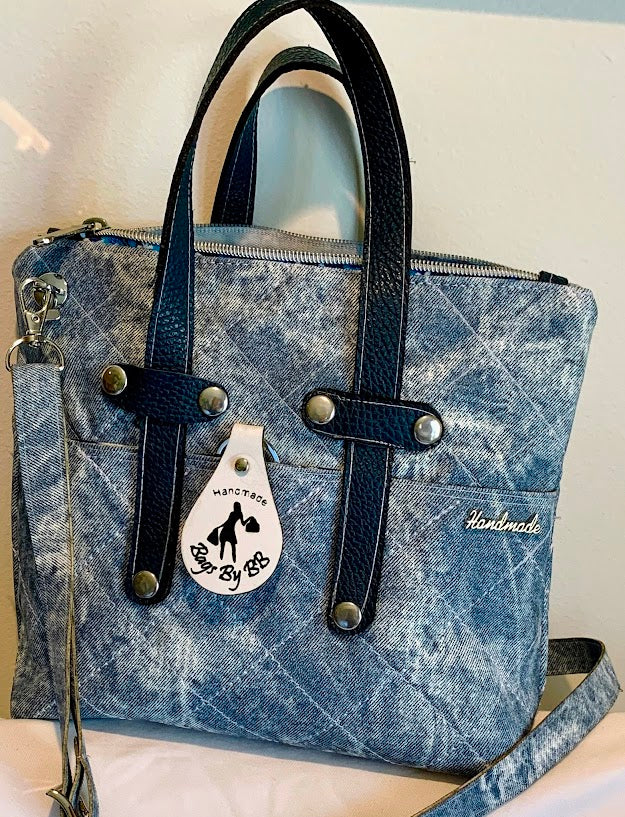 New material-denim colored vinyl with leather accents.