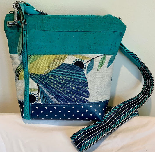 Bright, colorful, unique small crossbody in shades of teal, turquoise and blue.