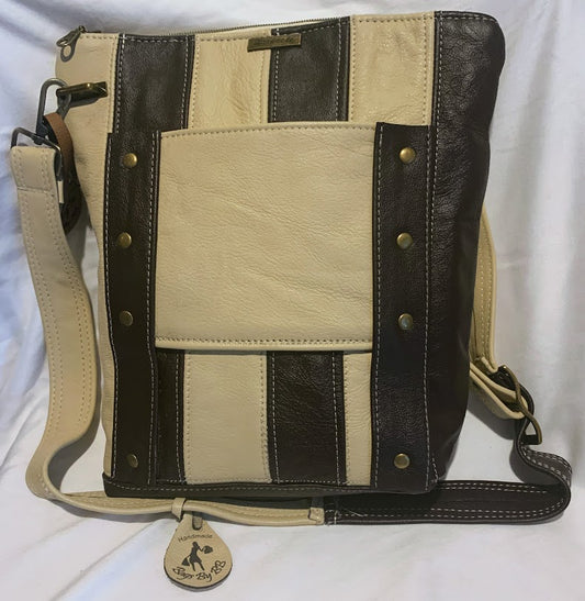 An all leather fully lined crossbody with both horizontal and vertical lines