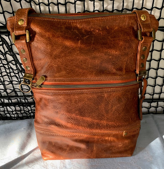 Distressed caramel colored leather tote