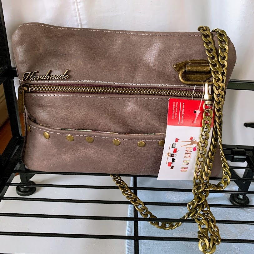 Mauve leather clutch/bag with heavy antique gold chain
