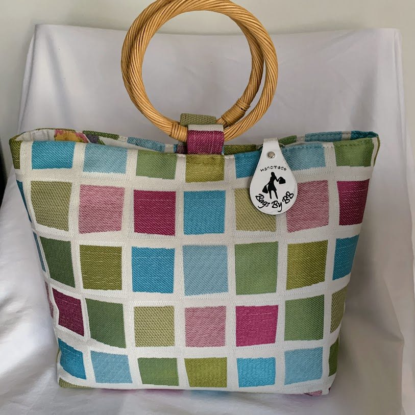 Designer fabric ring handle bag