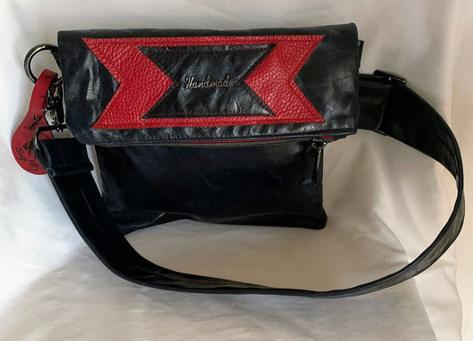 Fold over crossbody in navy leather with red enhancements