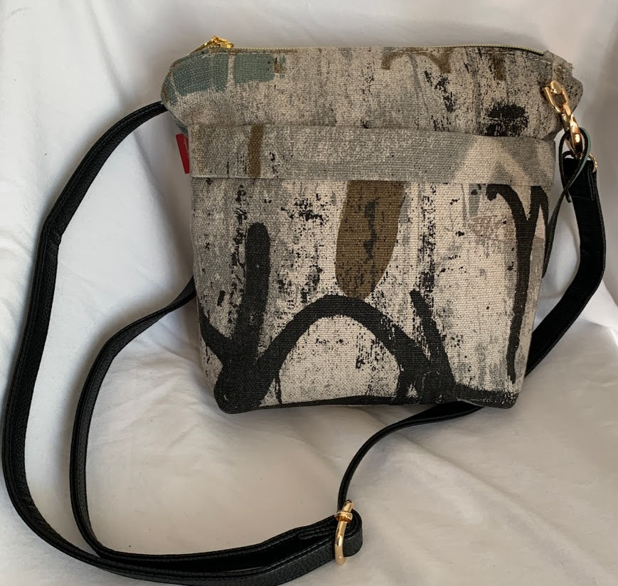 small, stylish home decor fabric crossbody with leather strap