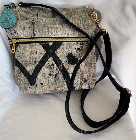 small, stylish home decor fabric crossbody with leather strap