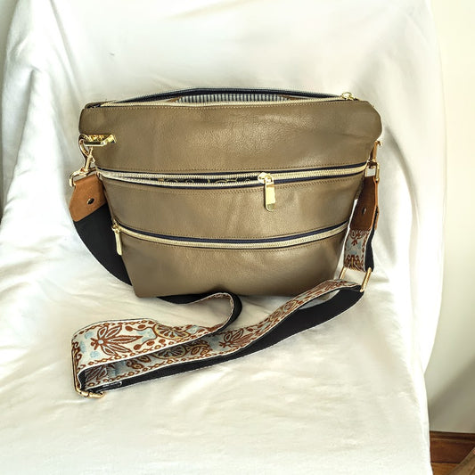 All leather, fully lined crossbody with adjustable strap