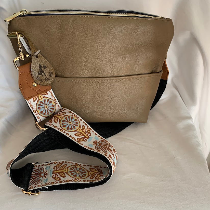 All leather, fully lined crossbody with adjustable strap