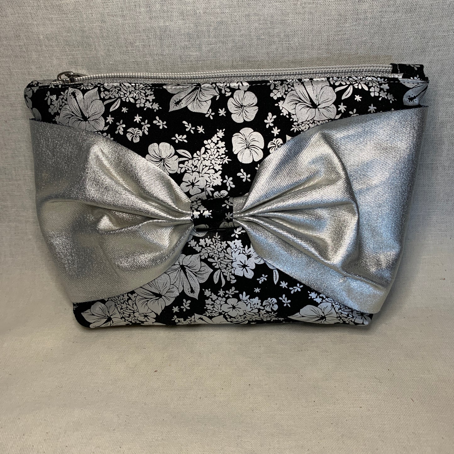 Cute and unusual fabric and vinyl bow pouch, evening wear or make up case? Your choice.