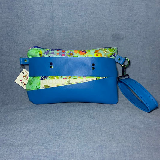 Wristlet with faux leather and coordinating fabric