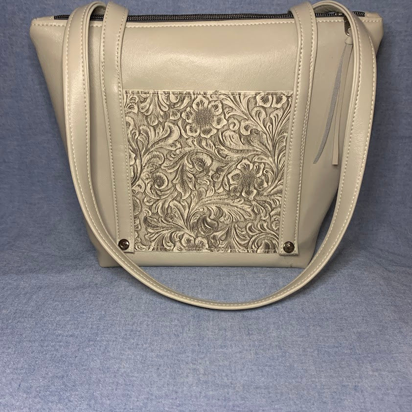 Vinyl tote bag with front and back embossed pockets