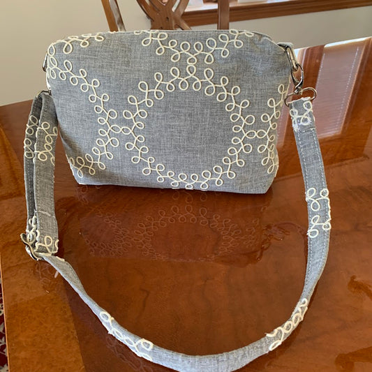 New Item! Distinctive gray and white fabric crossbody with quality nickel hardware.