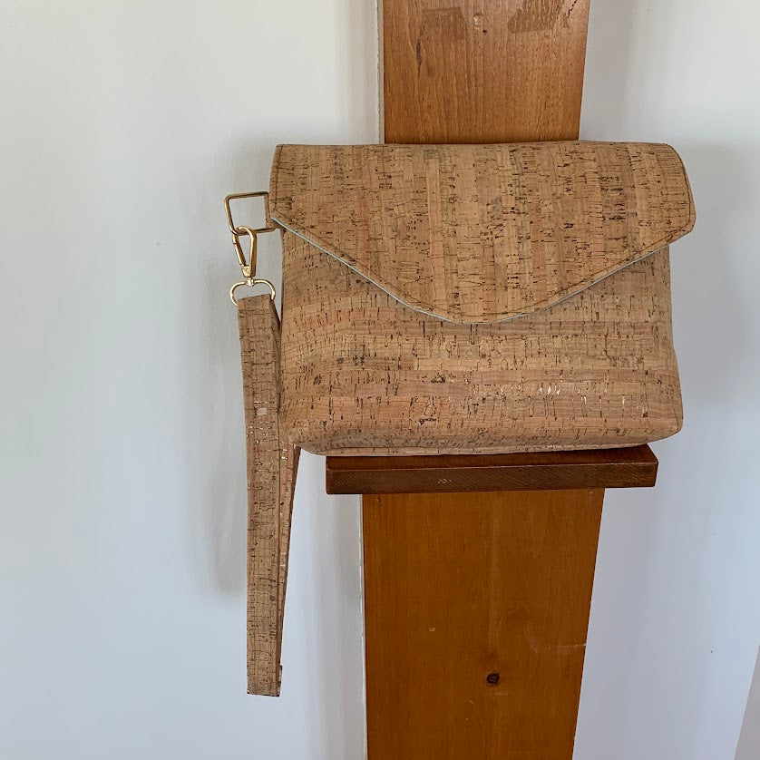 Cork crossbody with flap closure, exterior slip pocket, and fully lined