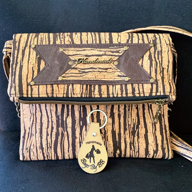 Cork crossbody with leather enhancement.