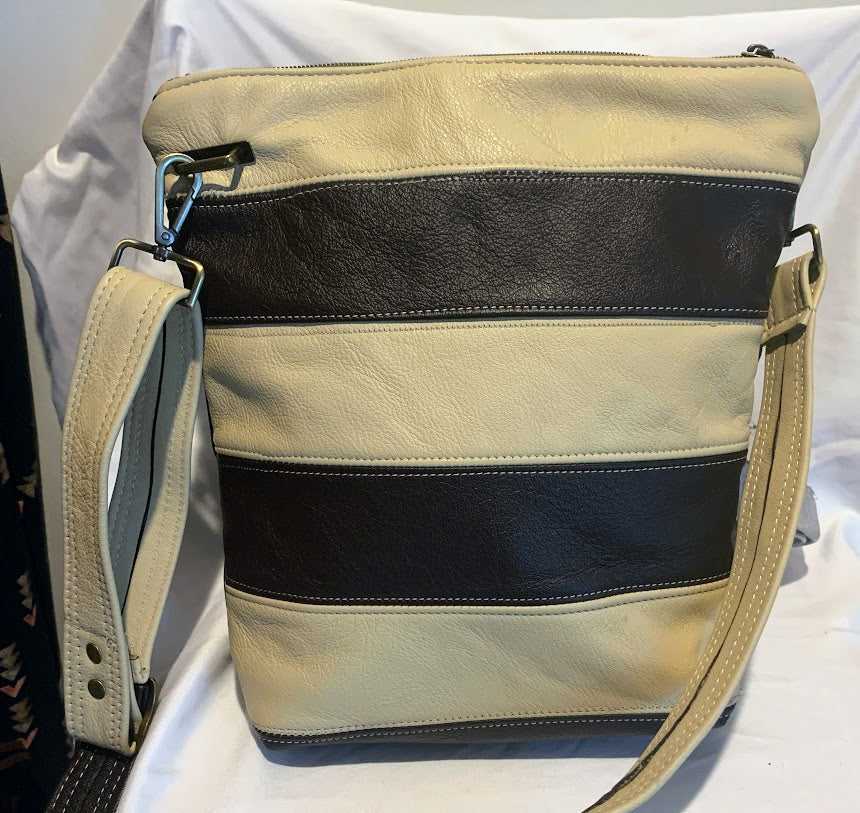 An all leather fully lined crossbody with both horizontal and vertical lines