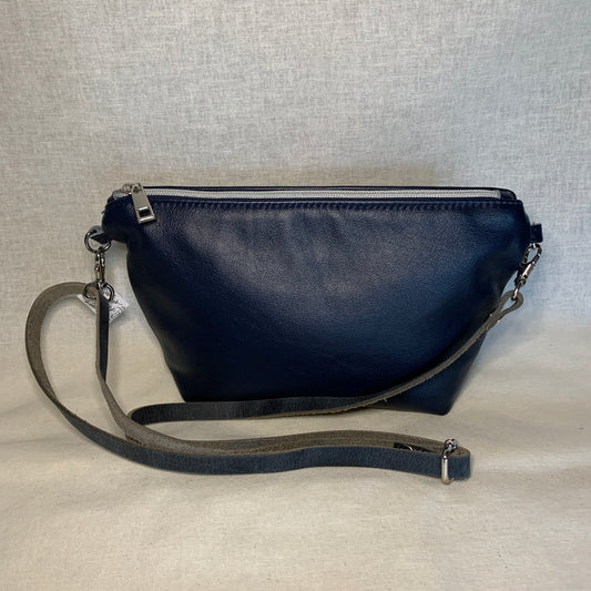 Navy blue leather mini crossbody with interior zipper pockets.