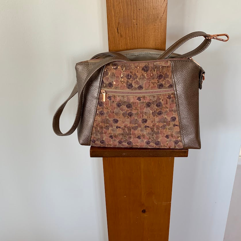 Unique cork and metallic vinyl crossbody.